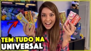 Gabi segurando várias barras de chocolate temáticas da Universal Orlando, incluindo Minions e Red Velvet