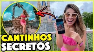 Gabi mostrando no celular uma foto tirada num cantinho secreto do Magic Kingdom, com o castelo ao fundo