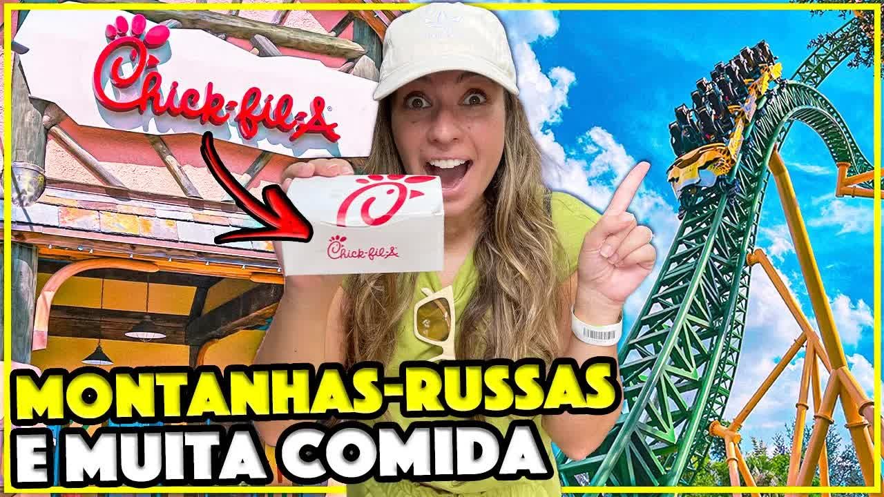Gabi mostrando a caixa do Chick-fil-A na frente da montanha-russa do Busch Gardens